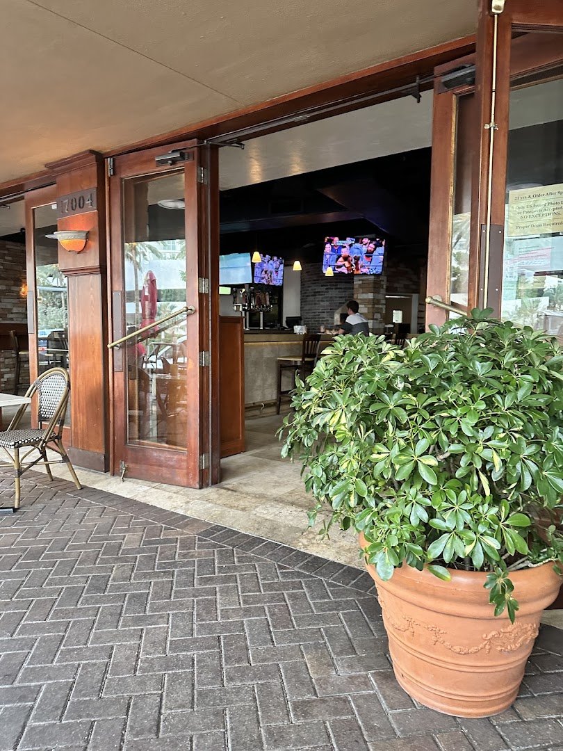 Dining room with tables and bar seating.