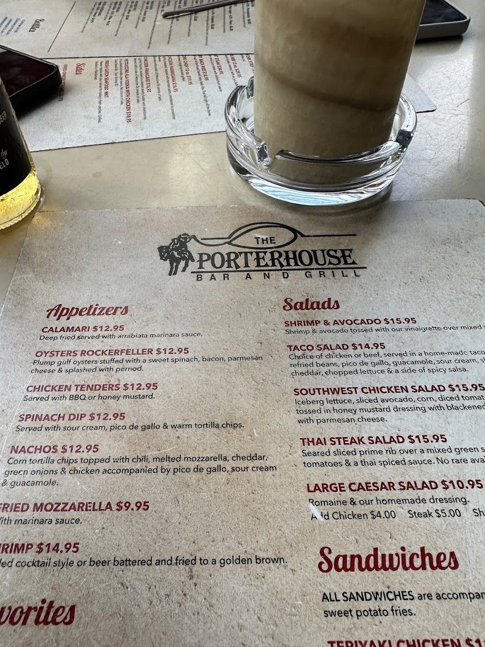 Printed menu with American bar and grill dishes.